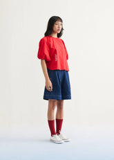 A Model Wearing Red Organic Cotton Ocean Air Organic Cotton Red Top, curated by Only Ethikal